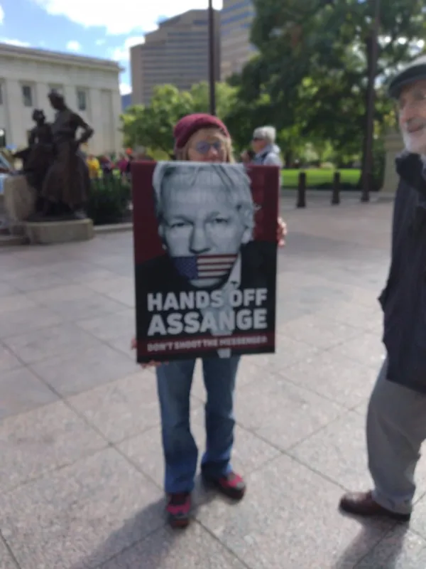 Woman holding sign