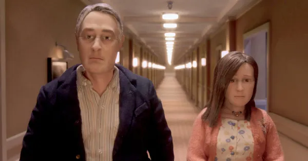 Man and woman walking down a hall