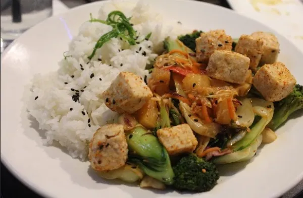 Tofu with grilled vegetables, and macadamia nuts.
