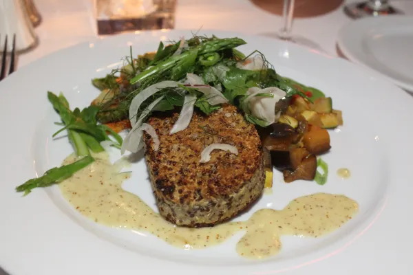 Quinoa and potato cake with fennel salad and roasted vegetables.