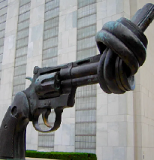 Statue of large gun with a knot at the end so a bullet couldn't come out